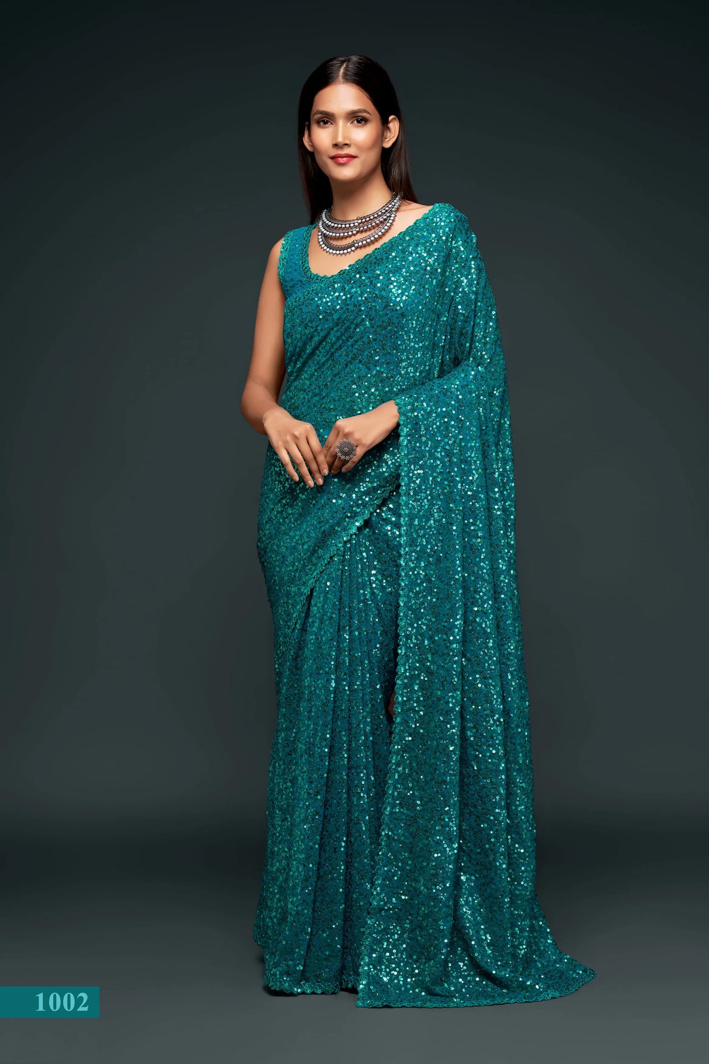 Lagoon blue georgette sari with thread embroidery and multiple sequins NAYA COLLECTION