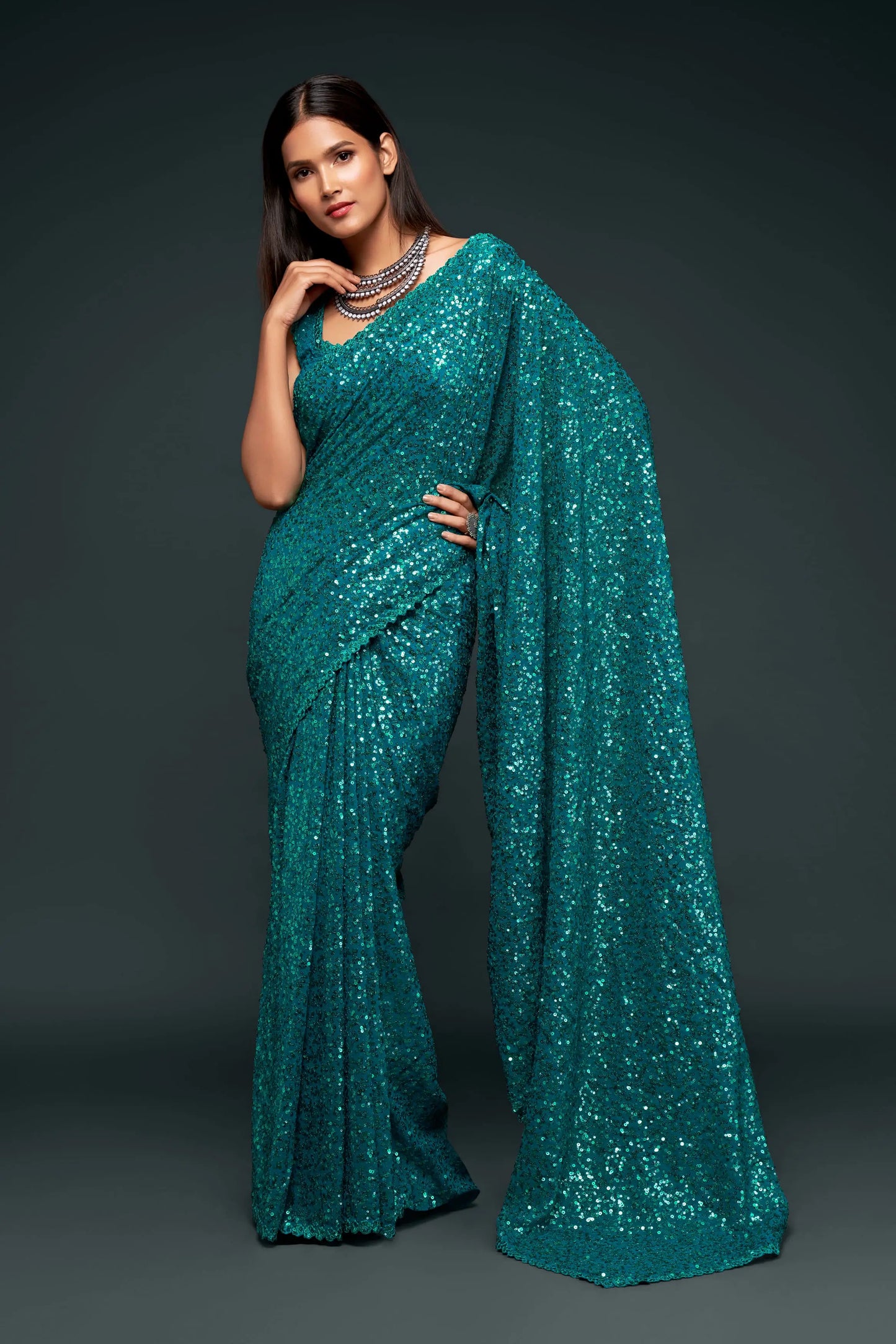 Lagoon blue georgette sari with thread embroidery and multiple sequins NAYA COLLECTION