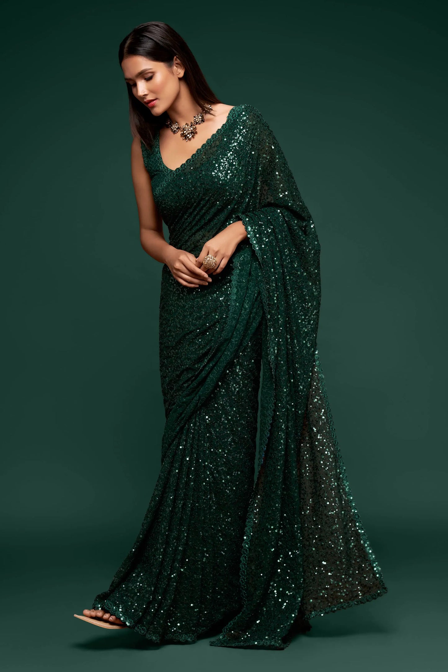 Dark green georgette sari with thread embroidery and multiple sequins NAYA COLLECTION
