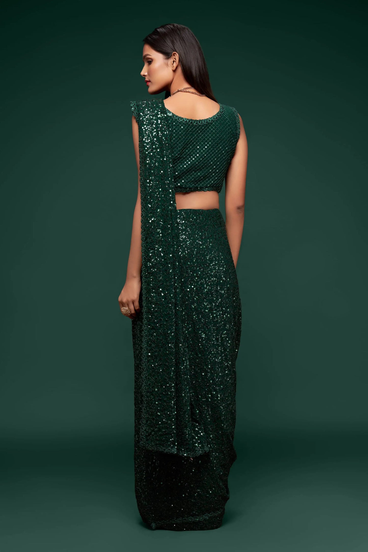Dark green georgette sari with thread embroidery and multiple sequins NAYA COLLECTION