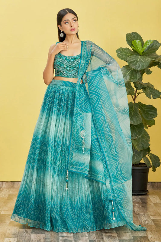 Ocean blue lehenga with digital print and sequin embroidery, adorned with real mirrors. RHEA COLLECTION.