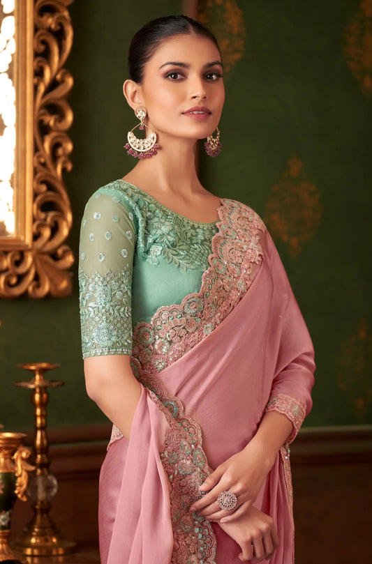Powder pink chiffon silk party sari with thread embroidery and sequins