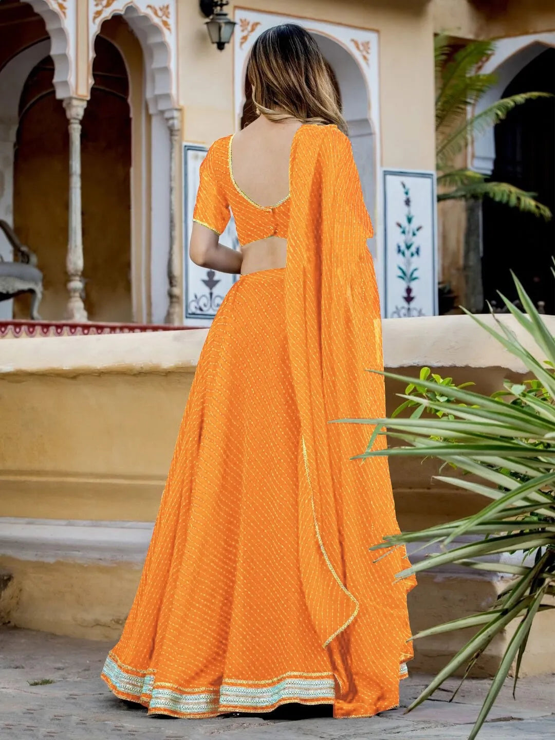Gorgeous Yellow Georgette Lehenga with Leheriya Print, Adorned with Zari Embroidery and Cording Lace