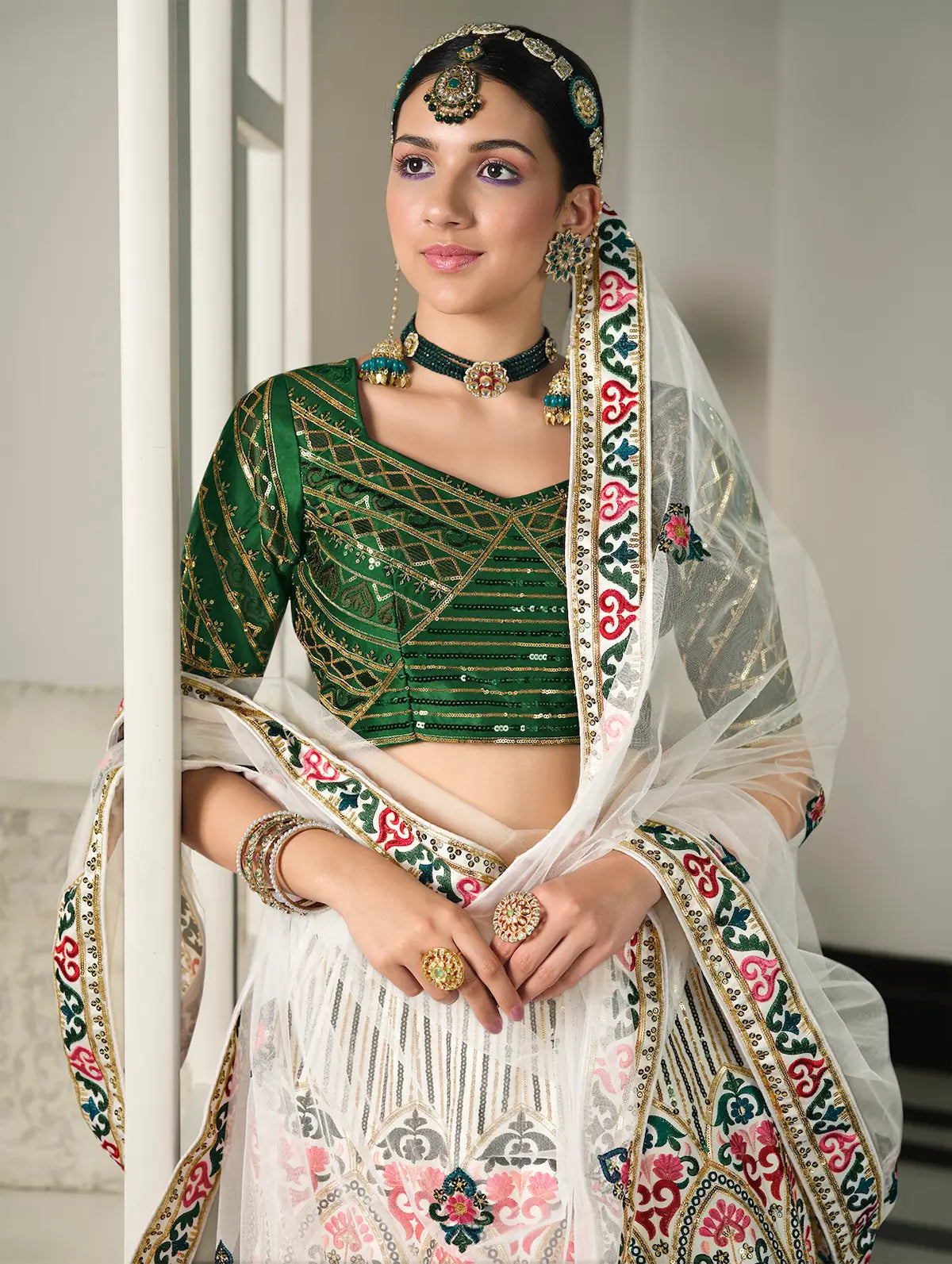 White and green silk lehenga choli with thread embroidery and sequins