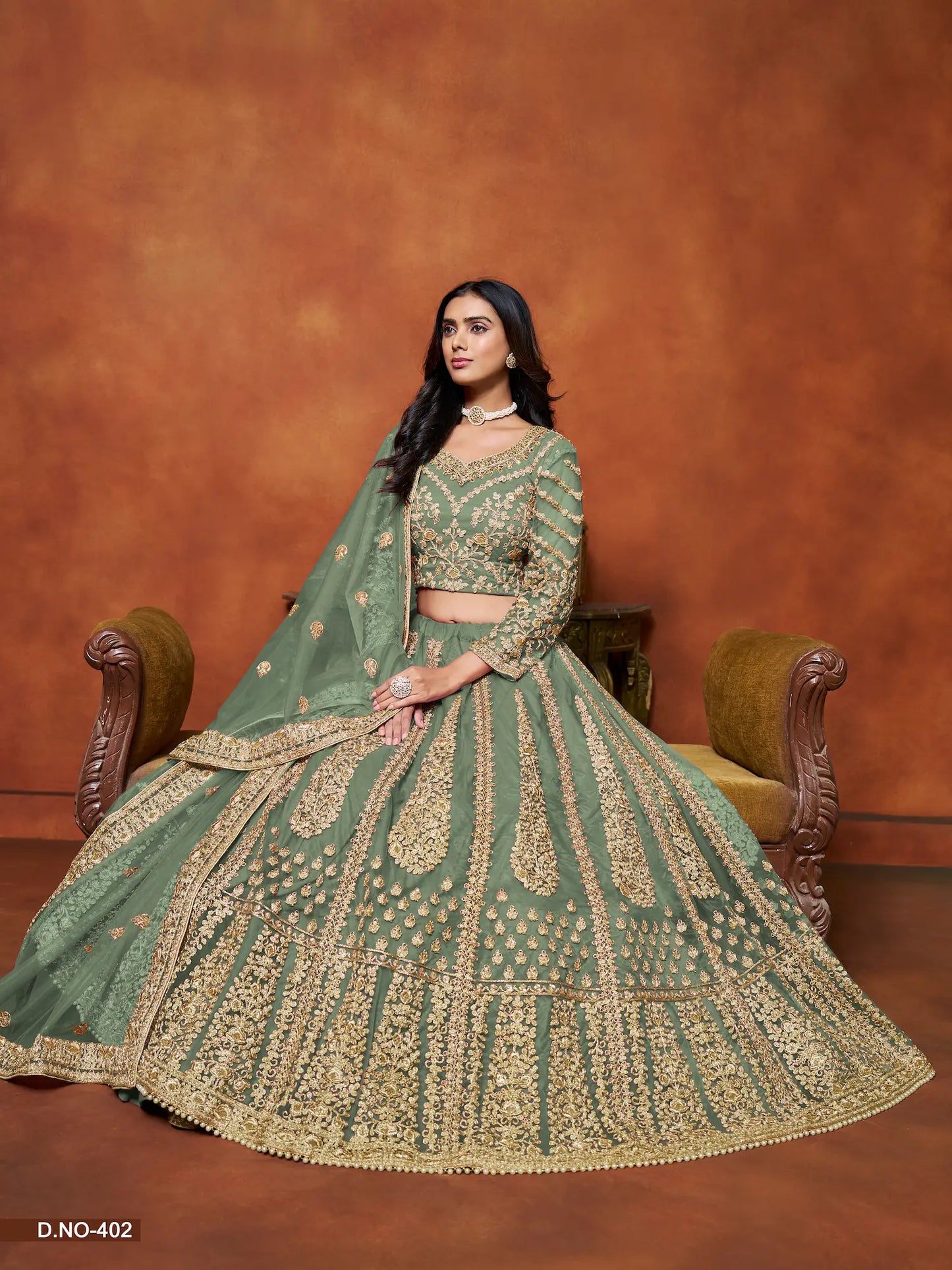 Pistaziengrünes Netz-Lehenga-Choli mit Faden- und Paillettenstickerei