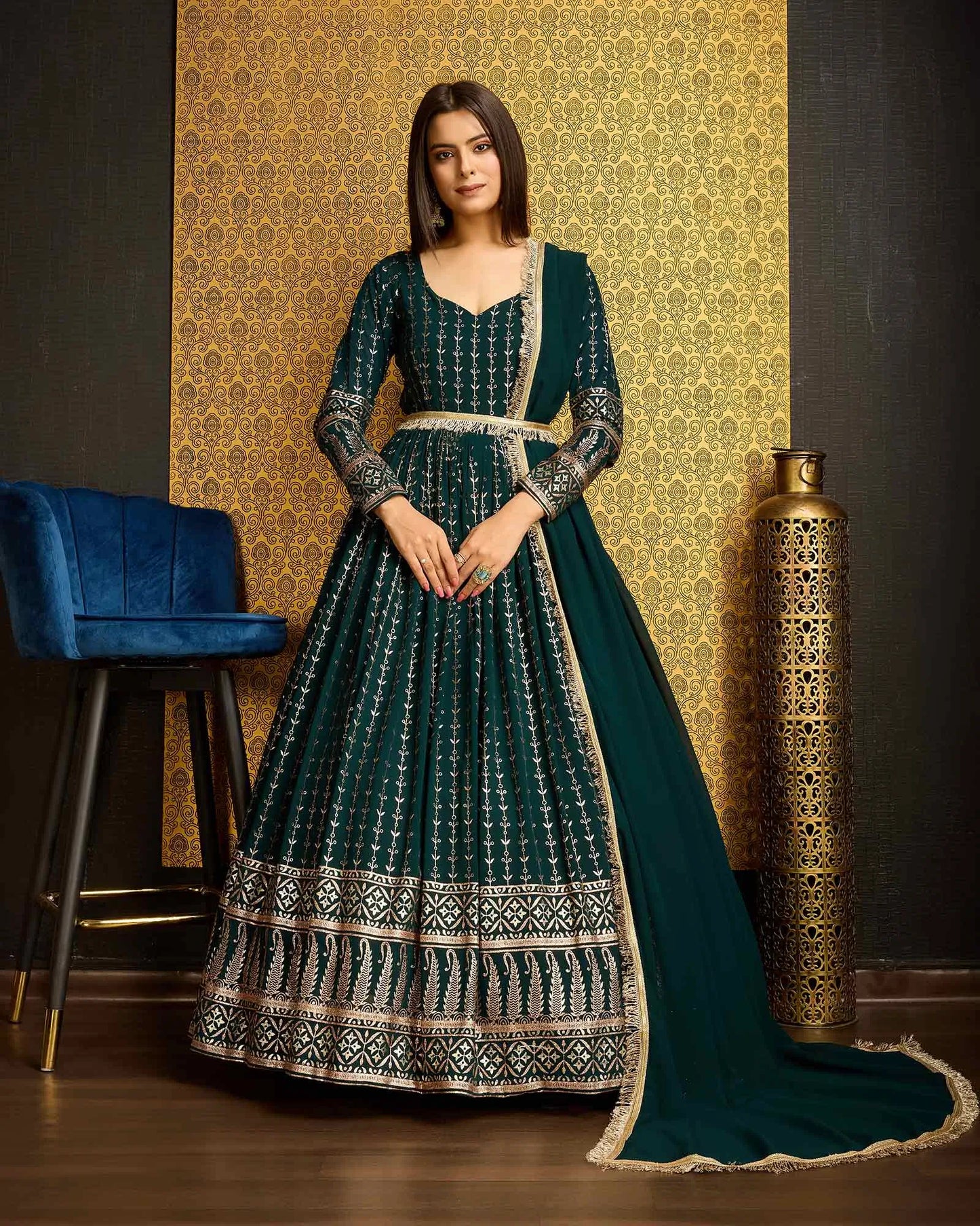 Dark green georgette dress with metallic foil work, accompanied by a dupatta
