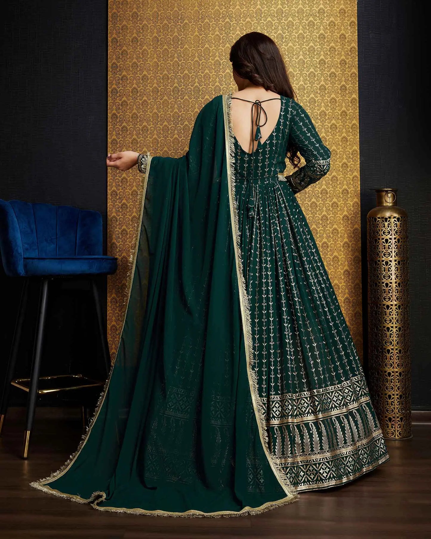 Dark green georgette dress with metallic foil work, accompanied by a dupatta