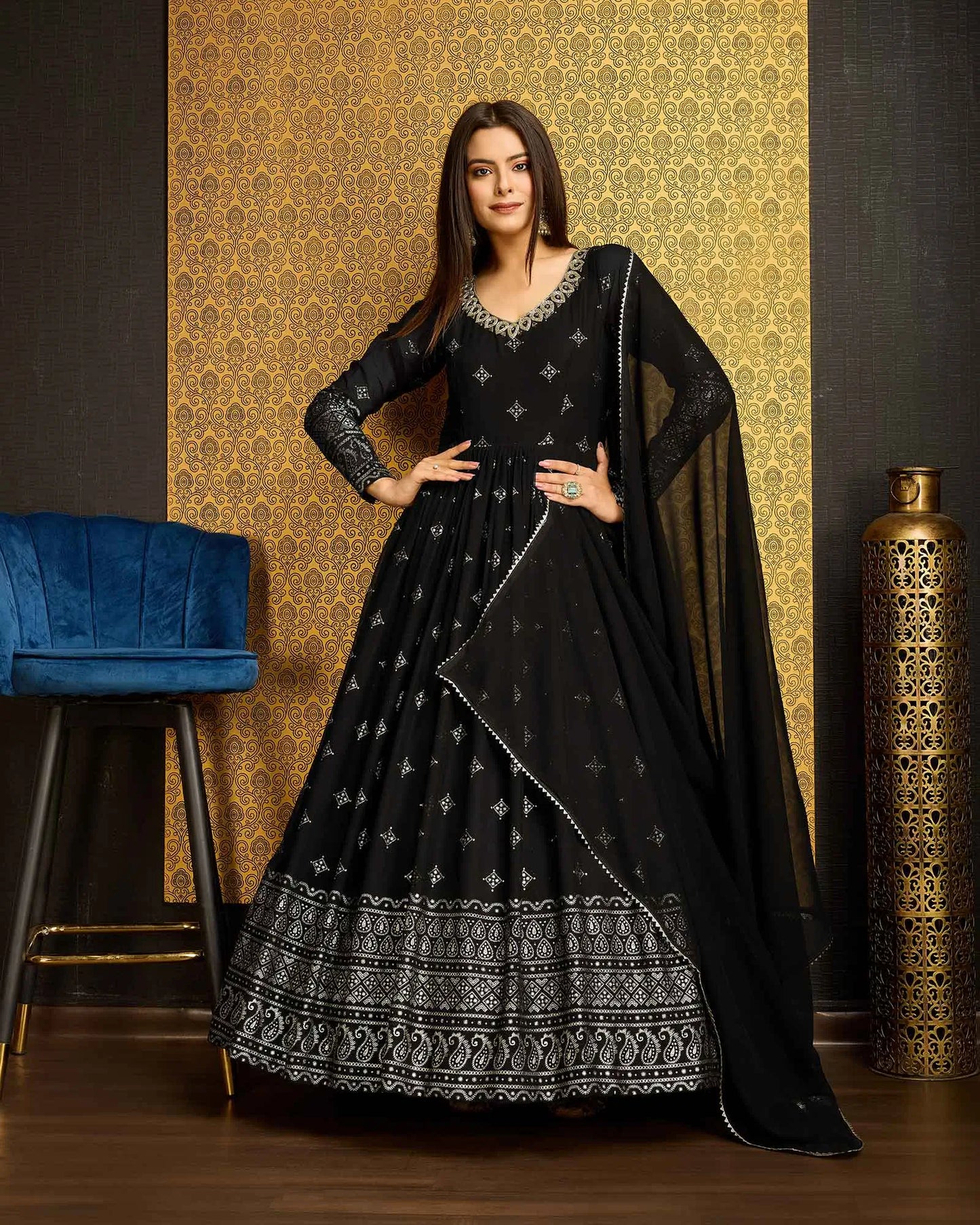Black georgette dress with metallic foil work, accompanied by a dupatta