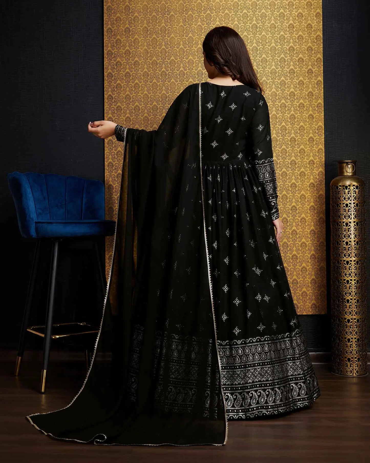 Black georgette dress with metallic foil work, accompanied by a dupatta