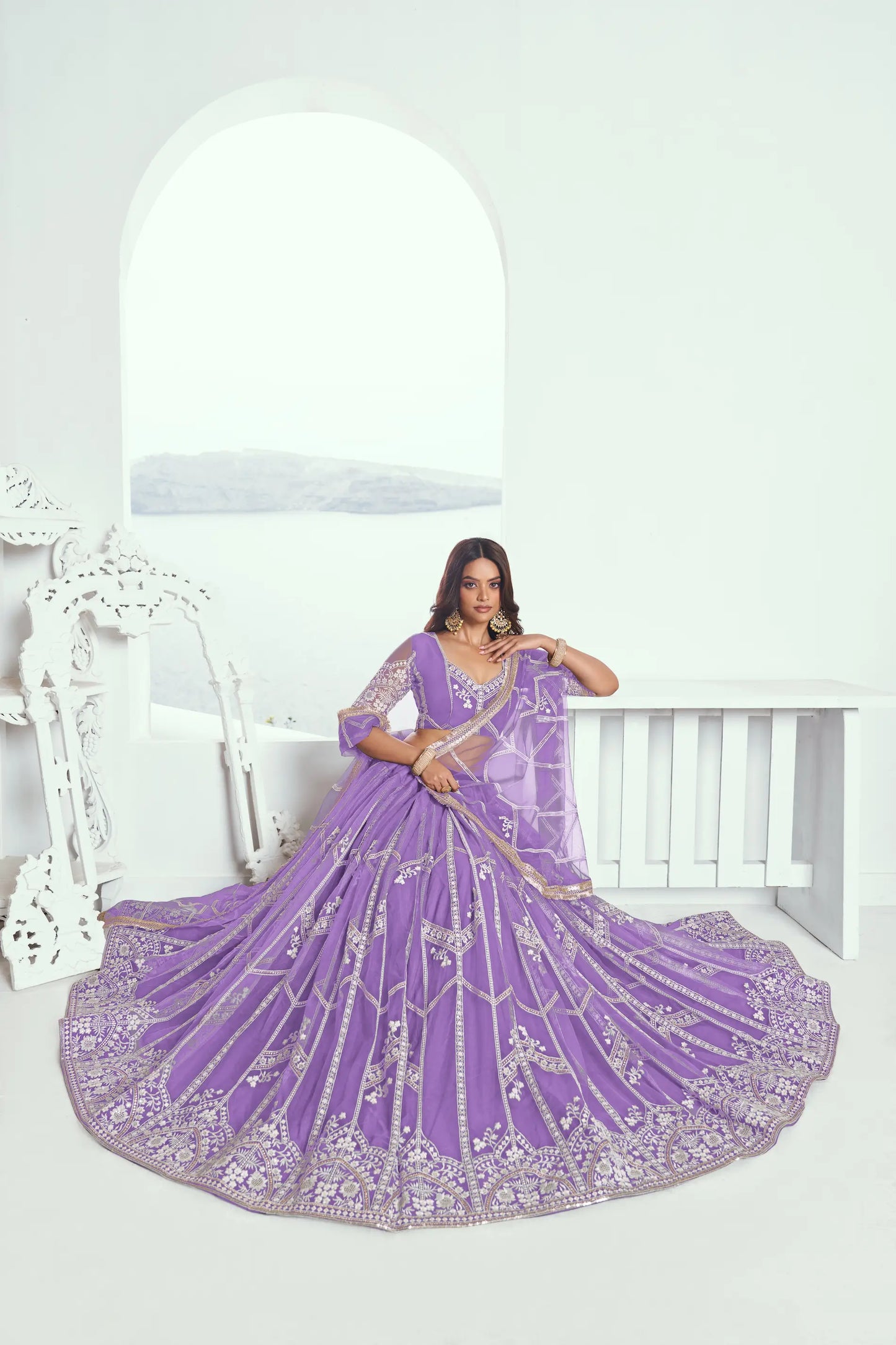 Lavender purple Lehenga Choli set in net fabric, adorned with delicate cotton thread embroidery and shimmering sequins CHANDRALEKHA COLLECTION