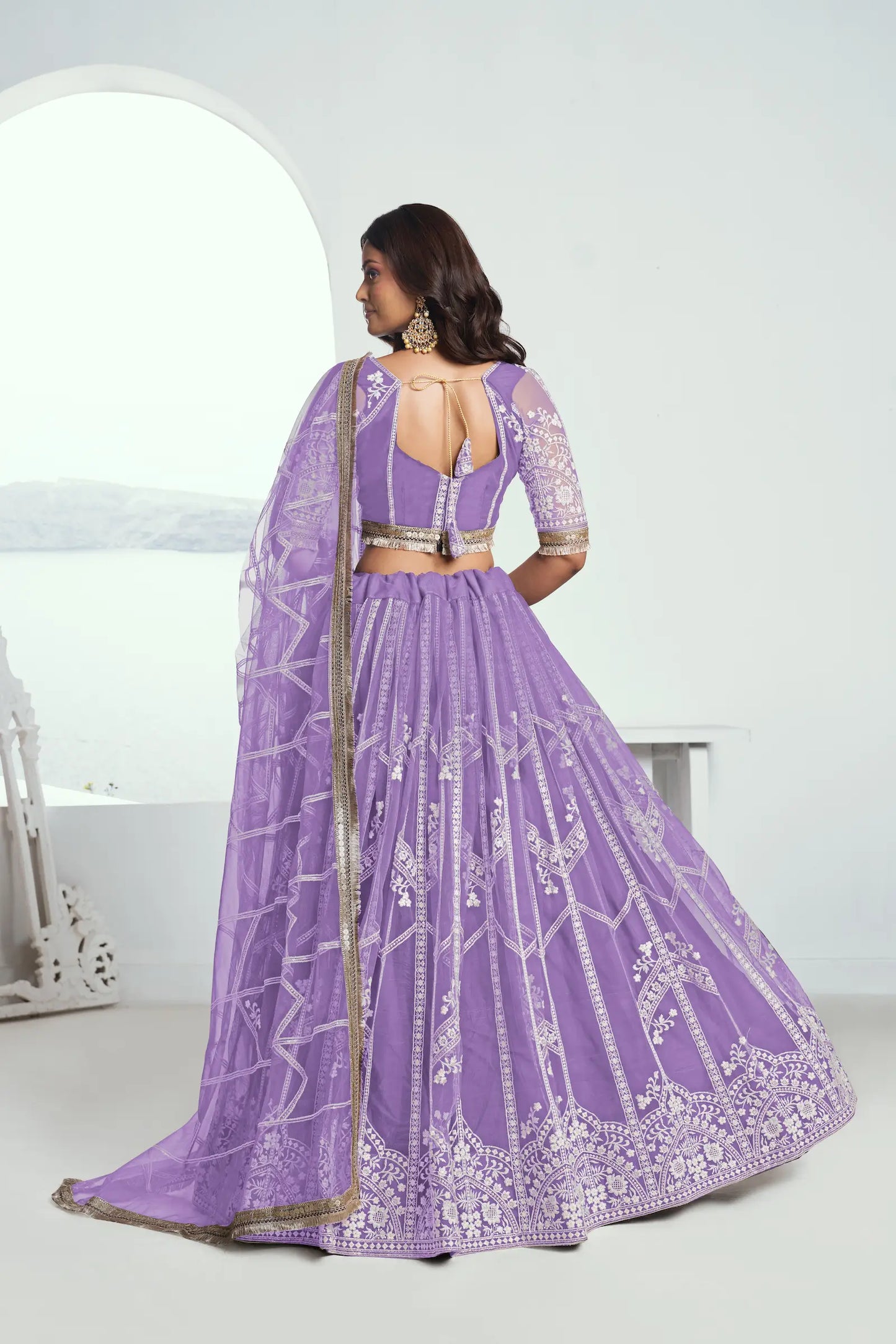 Lavender purple Lehenga Choli set in net fabric, adorned with delicate cotton thread embroidery and shimmering sequins CHANDRALEKHA COLLECTION