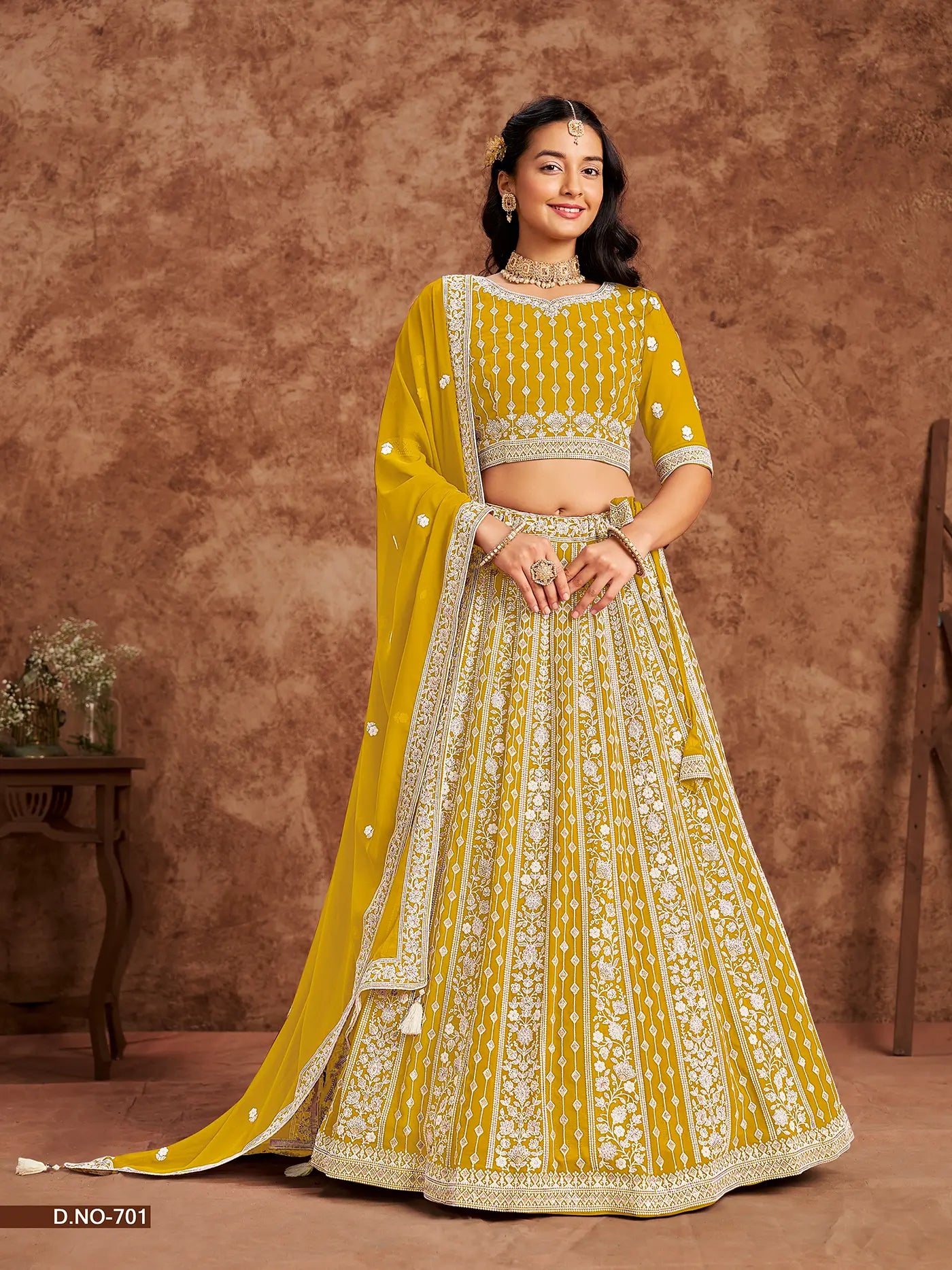 Designer Lehenga Choli gelb aus Kunstgeorgette mit Fadenstickerei und Pailletten
