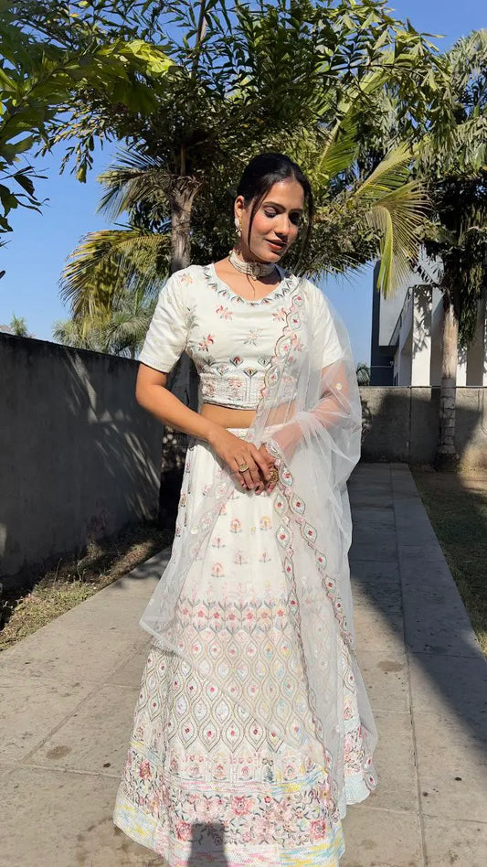 White georgette lehenga with multicolor thread embroidery, dori work and sequins