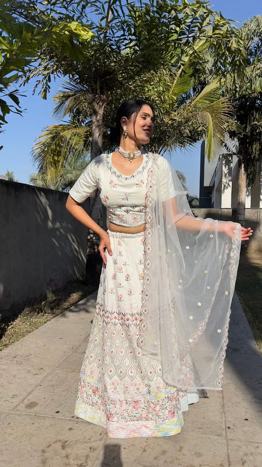 White georgette lehenga with multicolor thread embroidery, dori work and sequins