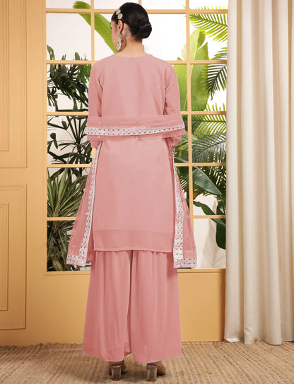 Salwar kameez pêche en georgette avec broderie à sequins