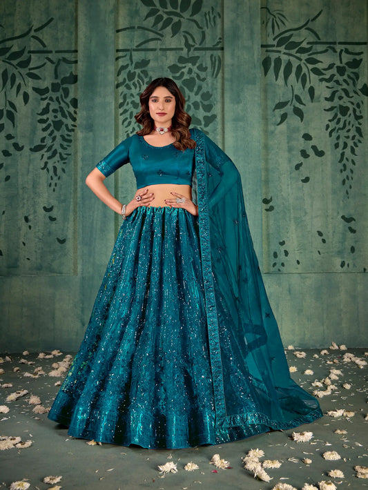Kristallblau-grünes Netz-Lehenga-Choli mit Fadenstickerei und Pailletten
