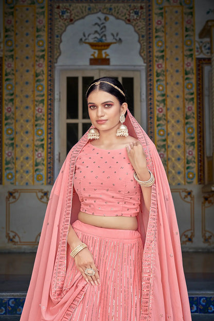 Lehenga choli rose pêche en georgette avec broderies de fils et sequins
