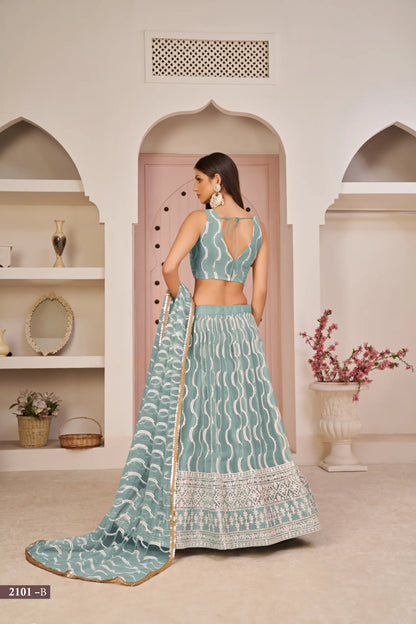 Lehenga Choli en filet bleu océan avec broderie en fil de coton blanc, travail en zari et sequins raffinés
