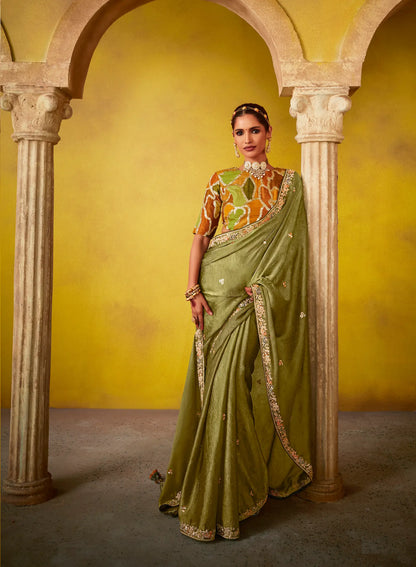 Olive green glass silk fabric sari with multi-colored orange blouse with digital print, sequin and thread embroidery
