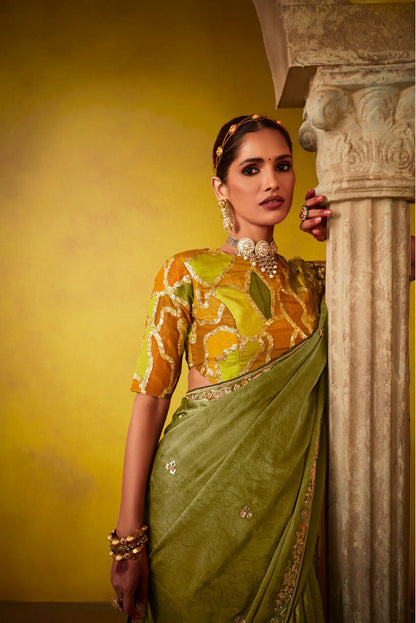 Olive green glass silk fabric sari with multi-colored orange blouse with digital print, sequin and thread embroidery
