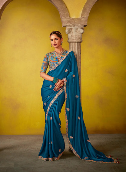 Teal blue glass silk fabric sari with multi-color blue blouse and digital print, sequin and thread embroidery