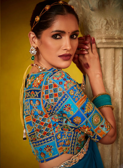 Teal blue glass silk fabric sari with multi-color blue blouse and digital print, sequin and thread embroidery