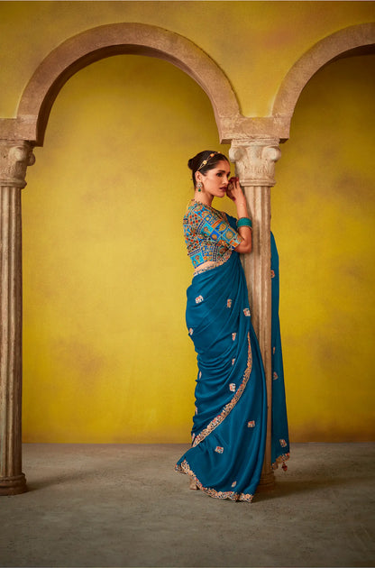 Teal blue glass silk fabric sari with multi-color blue blouse and digital print, sequin and thread embroidery