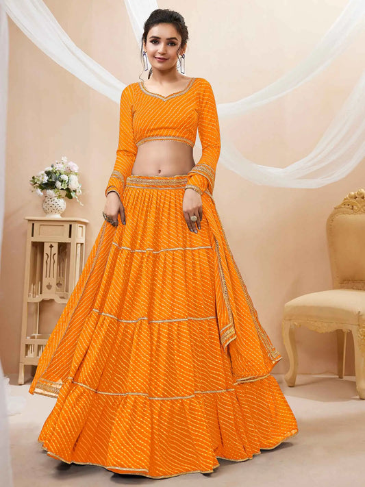 Lehenga jaune en georgette avec imprimé Leheriya et travail de dentelle sur toute la surface