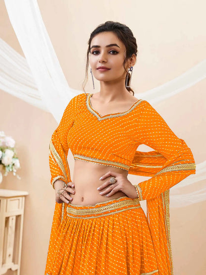 Lehenga jaune en georgette avec imprimé Leheriya et travail de dentelle sur toute la surface