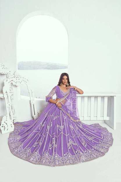 Lavender purple Lehenga Choli set in net fabric, adorned with delicate cotton thread embroidery and shimmering sequins CHANDRALEKHA COLLECTION