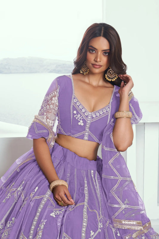 Lavender purple Lehenga Choli set in net fabric, adorned with delicate cotton thread embroidery and shimmering sequins CHANDRALEKHA COLLECTION