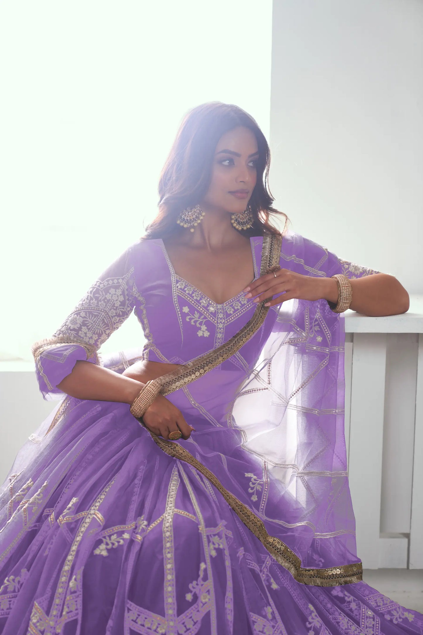 Lavender purple Lehenga Choli set in net fabric, adorned with delicate cotton thread embroidery and shimmering sequins CHANDRALEKHA COLLECTION