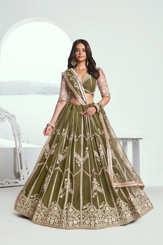 Olive green Lehenga Choli set in net fabric, adorned with delicate cotton thread embroidery and shiny sequins CHANDRALEKHA COLLECTION