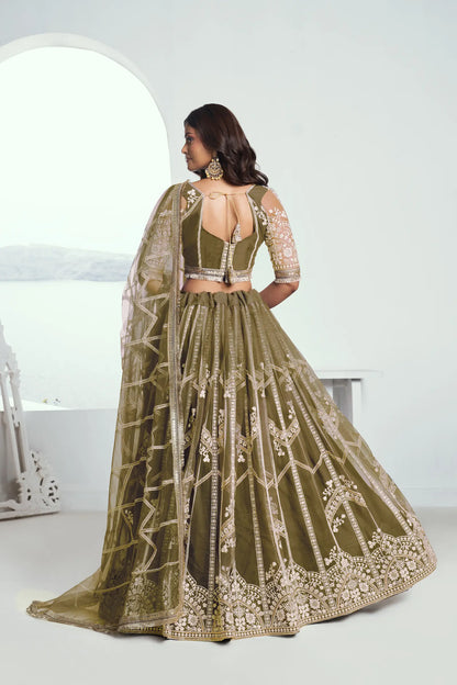 Olive green Lehenga Choli set in net fabric, adorned with delicate cotton thread embroidery and shiny sequins CHANDRALEKHA COLLECTION