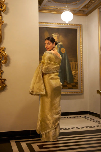 Gold shiny silk sari with zari weave and sequin lace border