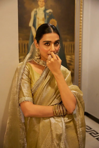 Gold shiny silk sari with zari weave and sequin lace border