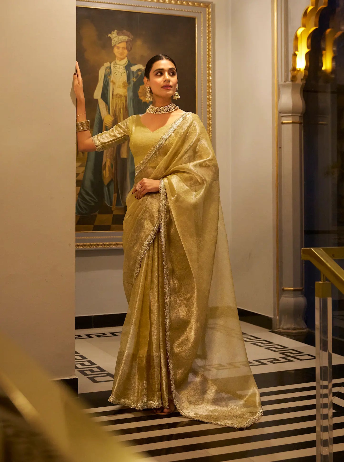 Gold shiny silk sari with zari weave and sequin lace border