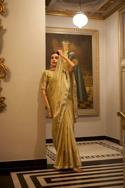 Gold shiny silk sari with zari weave and sequin lace border