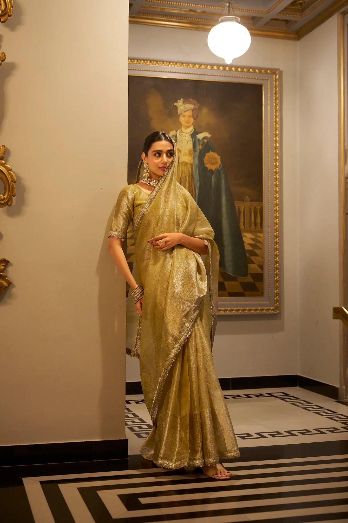Gold shiny silk sari with zari weave and sequin lace border