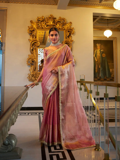 Light pink shiny silk sari with zari weaving work and sequin lace border