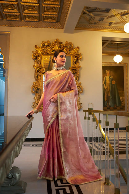 Light pink shiny silk sari with zari weaving work and sequin lace border