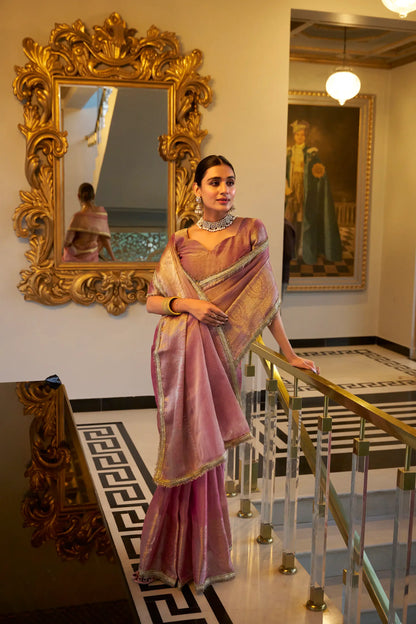 Light pink shiny silk sari with zari weaving work and sequin lace border