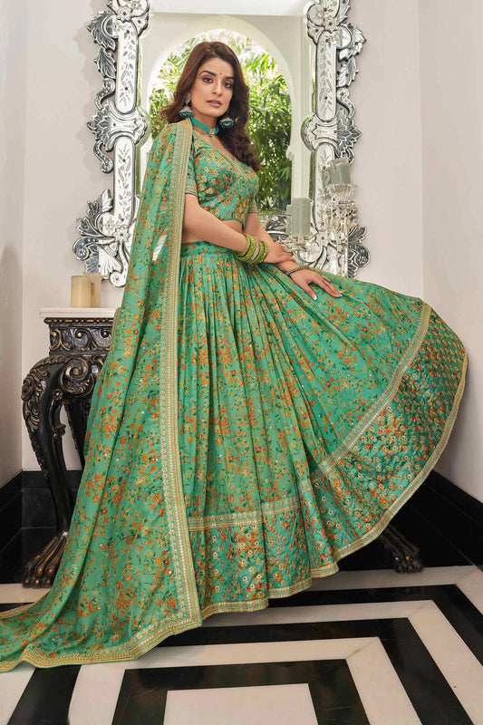 Lehenga en organza de couleur vert pistache avec imprimé floral et travail de broderie avec fil, zari, dori et sequins