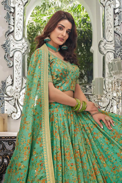 Lehenga en organza de couleur vert pistache avec imprimé floral et travail de broderie avec fil, zari, dori et sequins