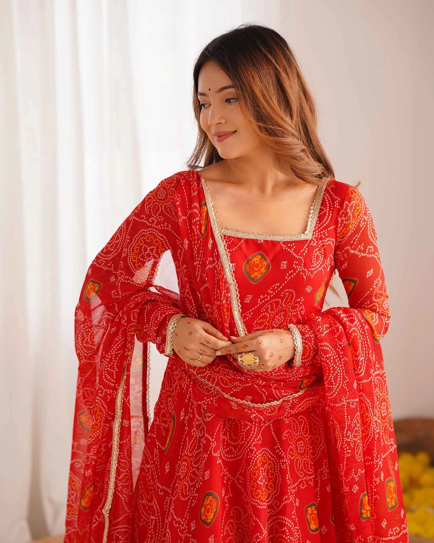 Ruby red long Anarkali dress in soft and light chiffon with Bandhej print